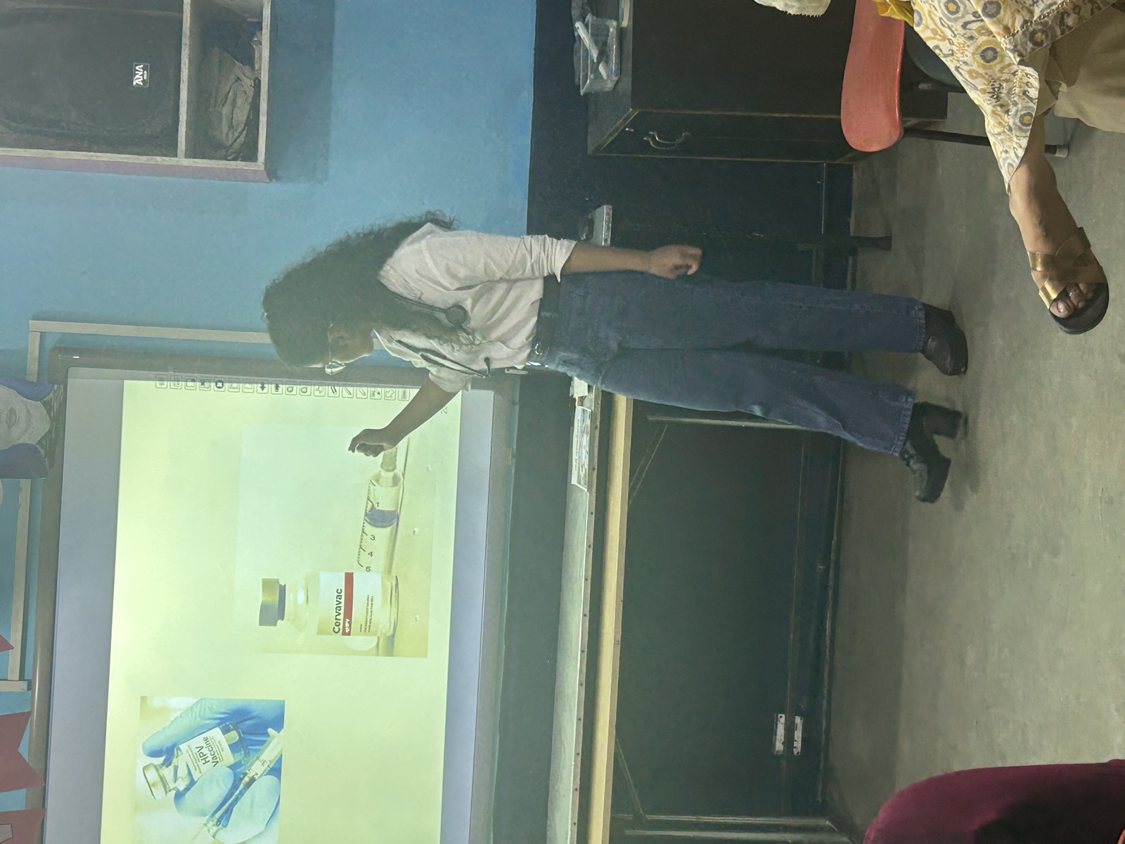 Health education session with projector presentation in a community center